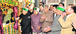 Chief Minister Virbhadra Singh inaugurates a rest house building at Kungash in Kullu on Friday. A Tribune Photograph