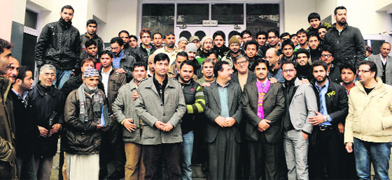 National Conference leaders with a group of students who joined the party in Srinagar on Saturday. Tribune photo: Amin War