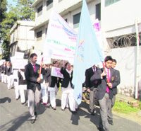 Students take out a march in Dehradun on Friday. 