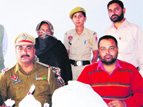 The police with the accused woman in Amritsar on Sunday.