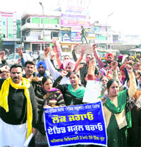 Members of the Bathinda unit of the Unaided Staff (Aided School) Front, Punjab, raise slogans against the state government during a protest march near Fauji Chowk on Sunday.