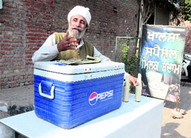 Balwant Singh selling milk badam on 100-feet road.
