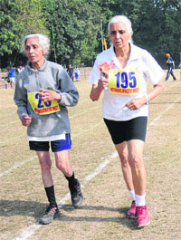 Veteran athletes participate in a 3-km walk during the State Veteran Athletics Meet in Chandigarh on Sunday