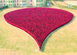 A total of 10,500 volunteers in red form the largest blood drop in the world at Dera Sacha Sauda in Sirsa on Sunday. 