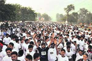People take part in the Kurukshetra Marathon on Sunday. 