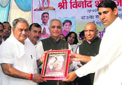 Venod Sharma felicitated during a public meeting at a village in Hisar on Sunday. 