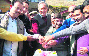 Maj Vijay Singh Mankotia with his supporters at his residence near Dharamsala on Saturday. 