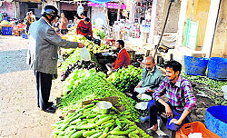 A vendor sells vegetables in Jammu