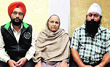 Nirmal Kour, wife of prisoner of war Capt Assa Singh, along with her sons at their residence in Jammu