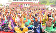 Members of the Mid Day Meal Workers Union, Punjab, protest for their demands in Jalandhar on Sunday.