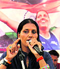 Congress candidate and Commonwealth Games gold medalist Krishna Poonia addresses an election rally in Sadulpur, Rajasthan