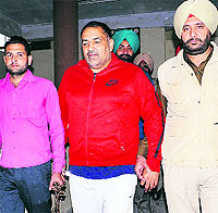 Jagdish Bhola (C) outside a Patiala court on Sunday