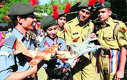 NCC cadets have a look at a model of transport aircraft and a fighter plane during the NCC Week celebrations in Sector 26, Chandigarh, on Monday