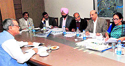 A former Haryana minister, Vinod Sharma ( on extreme left), files his objection regarding his land in Hallo Majra village before the members of the Board of Inquiry and Hearing in Chandigarh on Monday