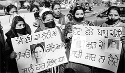 Non-teaching employees of the Sarva Shiksha Abhiyaan hold a protest for their rights at Phase V in Mohali on Monday