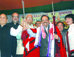 BJP's chief ministerial candidate Harsh Vardhan being greeted by the North-East people during an interaction at the party office in New Delhi on Monday.