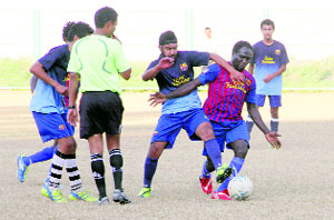 A match in progress in the Dehradun District Football Super League played at Pavillion Ground in Dehradun on Monday. 