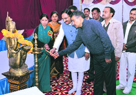 Former CM Ramesh Pokhriyal Nishank lights a lamp at the annual function of the Indian Academy in Dehradun on Monday. 