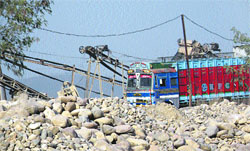 A crusher operating in the Chaki river .