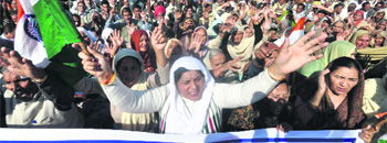 Members of the POKDP Front raise slogans during the Martyrs Day at Neta ji Subhash Chandra Bose Chowk in Jammu on Monday. 