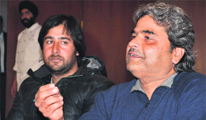 Film director Vishal Bhardwaj (right) addresses mediapersons in Srinagar on Monday.