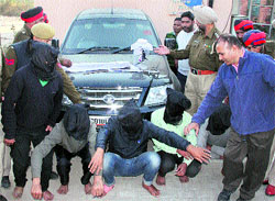 The alleged contract killers in police custody in Jalandhar on Monday. 