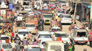 Traffic chaos on the busy Kishanpura road caused by the escort and official vehicles of Punjab Vidhan Sabha Speaker Charanjit Singh Atwal in Jalandhar on Monday.