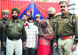 The accused, Manoj Kumar and Sunita, being taken to a court in Ludhiana on Monday.