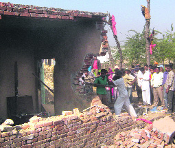 Unidentified persons brought down the house of a rape and murder accused in Kapurthalas Boota village on Monday. The police has registered a case. 