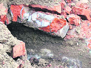A structure built with Nanakshahi bricks was unearthed during expansion work at the Sri Guru Ram Das Langar Hall at the Golden Temple complex in Amritsar on Monday. The SGPC secretary, Manjit Singh, said rumours about it being a tunnel were baseless.