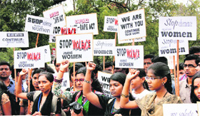 Women protest against atrocities Men Against Rape and Discrimination.