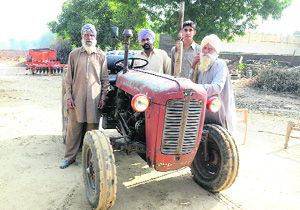 The family of Kapoor Singh with the tractor in Gobindpura village. 