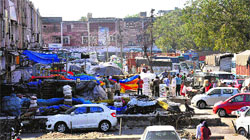 Food grains and cereals stacked on open platforms of shops-cum-flats at Sector 26 Grain Market, Chandigarh. Tribune photo: Manoj Mahajan