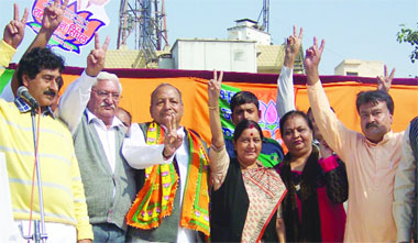 BJP leader Sushma Swaraj (C) campaigning for the party candidate from Adarsh Nagar, Ram Kishnan Singhal (3rd-L) with other local leaders ahead of the Delhi Assembly elections in North Delhi on Tuesday.