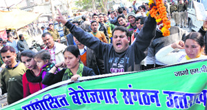 Unemployed BPed and MPed youths hold a protest in Dehradun on Tuesday. 