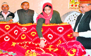 District Magistrate, Haridwar, Nidhi Pandey, offers a chaddar at the dargah of Baba Roshan Ali Shah Rahmatullah in Haridwar on Tuesday. 