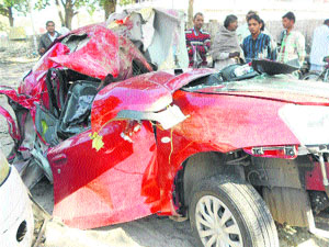The mangled remains of a car that rammed into a tree near Tejewala in Yamunanagar district on Tuesday.