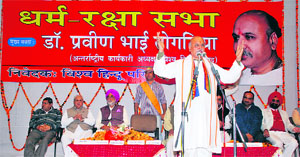 Dr Praveen Togadia, working president of the VHP, addresses a dharam raksha sabha in Kurukshetra on Monday.