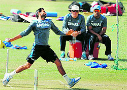 Skipper MS Dhoni and coach Duncan Fletcher observe Mohammad Shami during nets on Tuesday