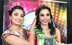 Monica Gill being crowned Miss India USA 2013 by outgoing title-holder Priyan Bhargava in New Jersey on Sunday. 