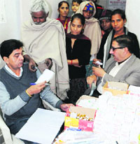 Members of an NGO, Sewa Bharati, collect unused medicines in Amritsar on Wednesday. Photo: Vishal Kumar