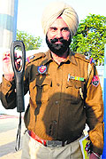 A policeman with the new metal-cum-drug detector that will be put to use during the inaugural ceremony at the Multi-purpose Sports Stadium on November 30