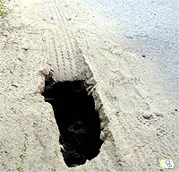 A damaged road in Butrela village