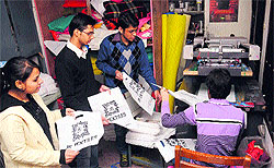 PU students assist a member of a self-help group in making cloth bags in Chandigarh