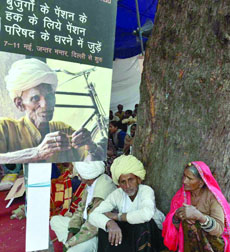 People participate in a rally, demanding the old age pension at Jantar Mantar in New Delhi on Wednesday.