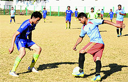Players in action during a match in the Dehradun District Football Super League Tournament played at Pavillion Ground in Dehradun on Wednesday