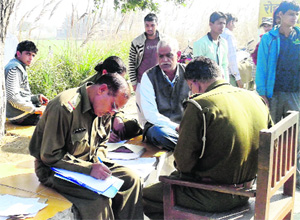 Government Railway Police officials at the suicide spot in Rohad village of Jhajjar on Wednesday. 