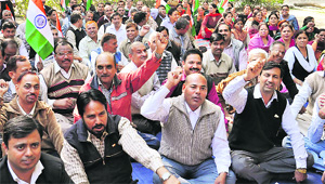 School lecturers protest in support of their demands in Karnal on Wednesday. 
