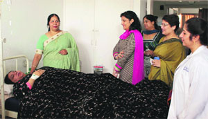 BWWA vice-president Urmila Uniyal and secretary Neelima Jaswal talk to a patient at the BSF Hospital, BSF headquarters (Punjab Frontier), in Jalandhar on Wednesday