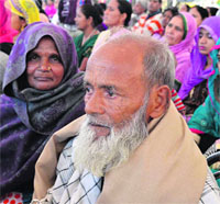 Parents of a recruit, Sajid Sah from Uttar Pradesh, watch the passing-out parade. 